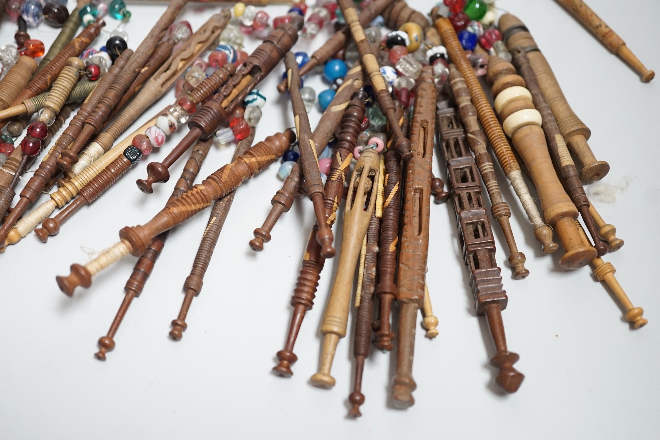 Fifty 19th century finely turned wooden lace bobbins with beaded ends together with 35 ornate wooden bobbins with beaded ends and 5 plain wooden bobbins unleaded (90)